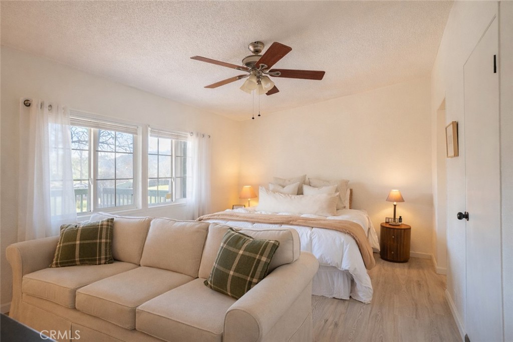 4114 Shetland Way Paso Robles, CA 93446 - Photo 6 of 13 a bed room with a bed and a couch