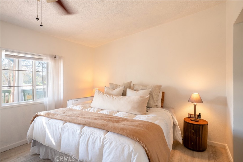 4114 Shetland Way Paso Robles, CA 93446 - Photo 10 of 13 a bedroom with a bed and a lamp