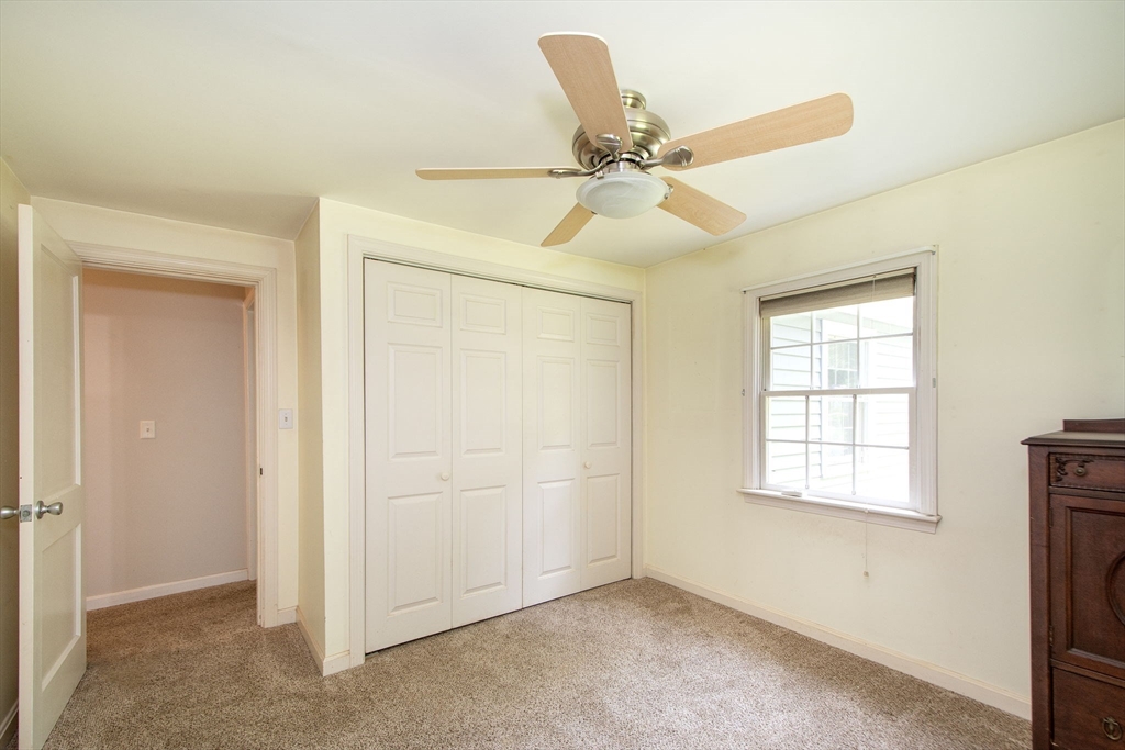 45 Cornet Stetson Road Scituate, MA 02066 - Photo 13 of 23 an empty room with windows and fan
