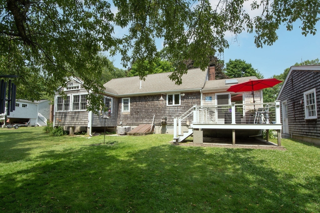 45 Cornet Stetson Road Scituate, MA 02066 - Photo 18 of 23 a view of a house with a yard patio and a garden