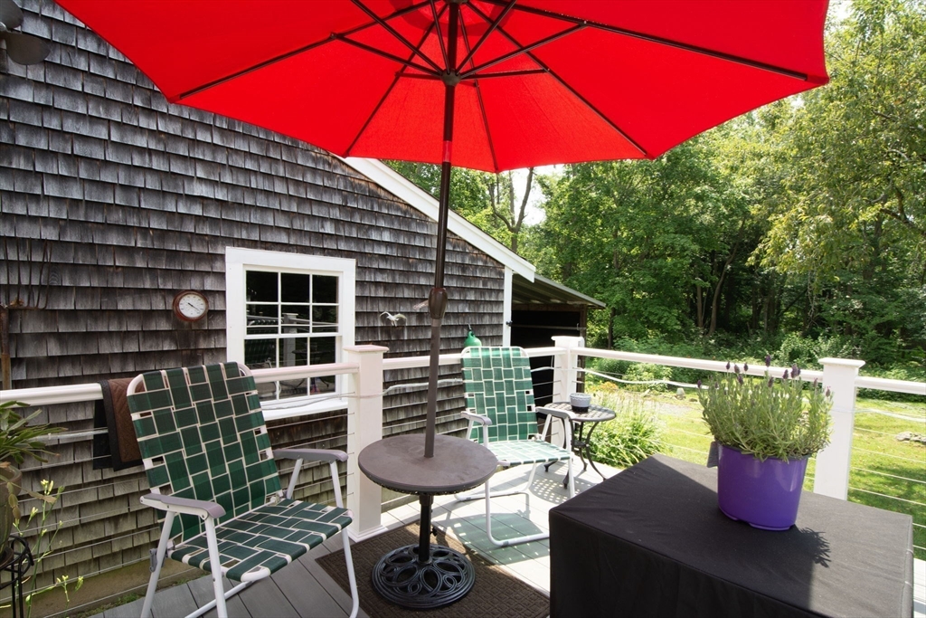 45 Cornet Stetson Road Scituate, MA 02066 - Photo 20 of 23 a balcony with table and chairs
