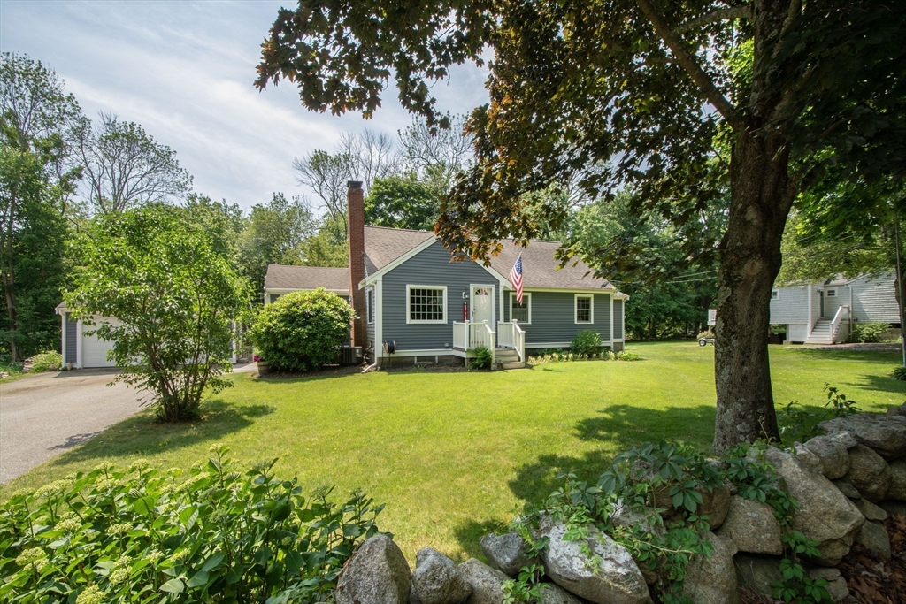 45 Cornet Stetson Road Scituate, MA 02066 - Photo 2 of 23 a front view of a house with yard and green space