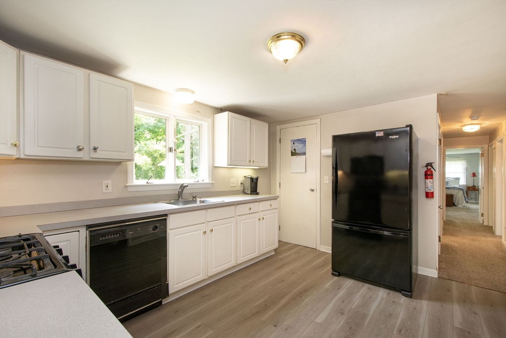 45 Cornet Stetson Road Scituate, MA 02066 - Photo 7 of 23 a kitchen with a sink stove and refrigerator