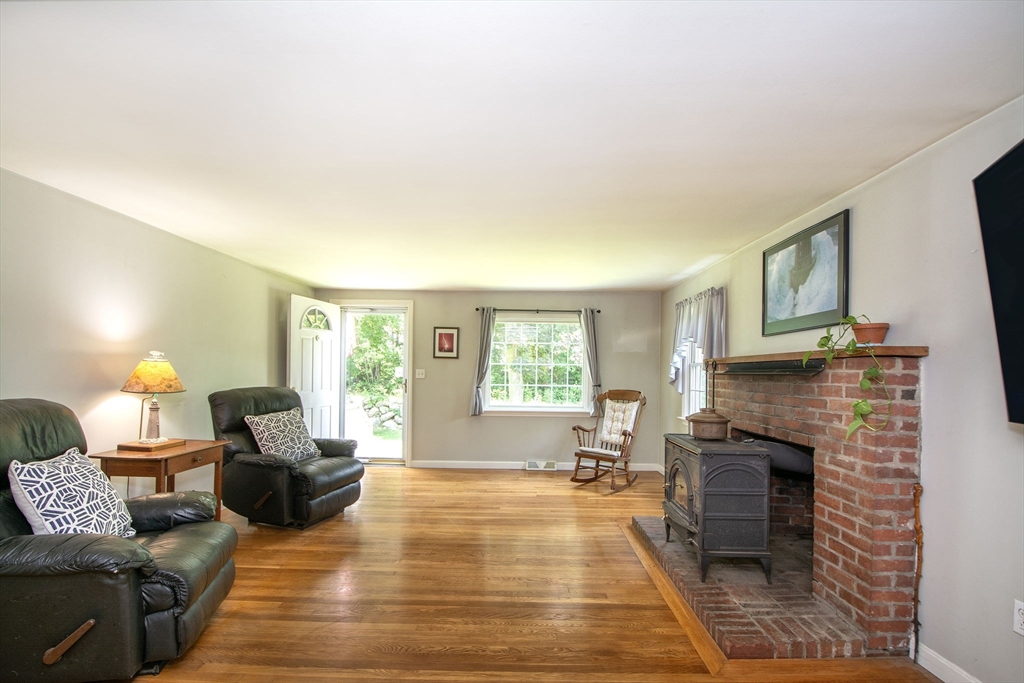 45 Cornet Stetson Road Scituate, MA 02066 - Photo 8 of 23 a living room with furniture and a fireplace