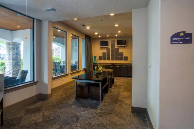 a view of living room with furniture and floor to ceiling window