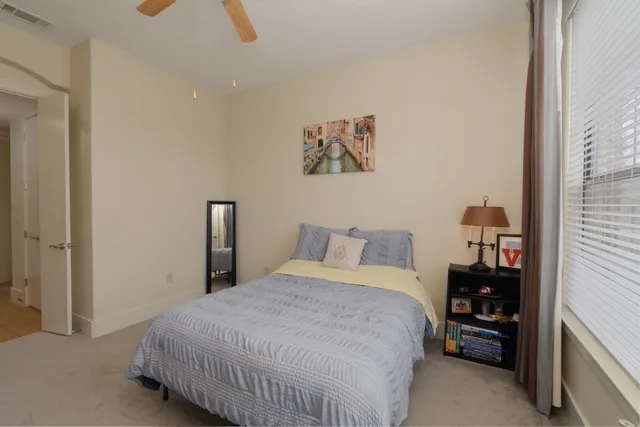 a bedroom with a bed and a walk in closet