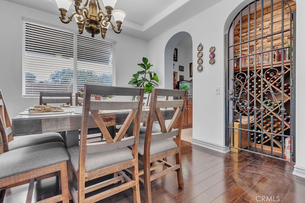 42740 Portraits Lane Temecula, CA 92592 - Photo 15 of 68 a view of a dining room with furniture and wooden floor