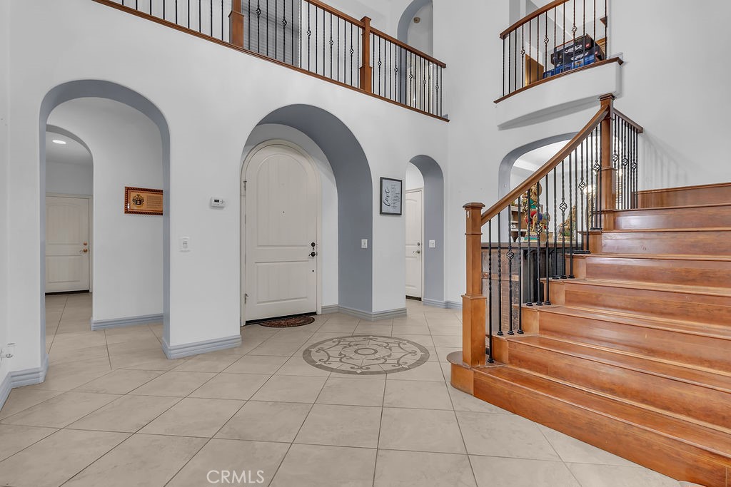 42740 Portraits Lane Temecula, CA 92592 - Photo 17 of 68 a view of entryway and hall with wooden floor