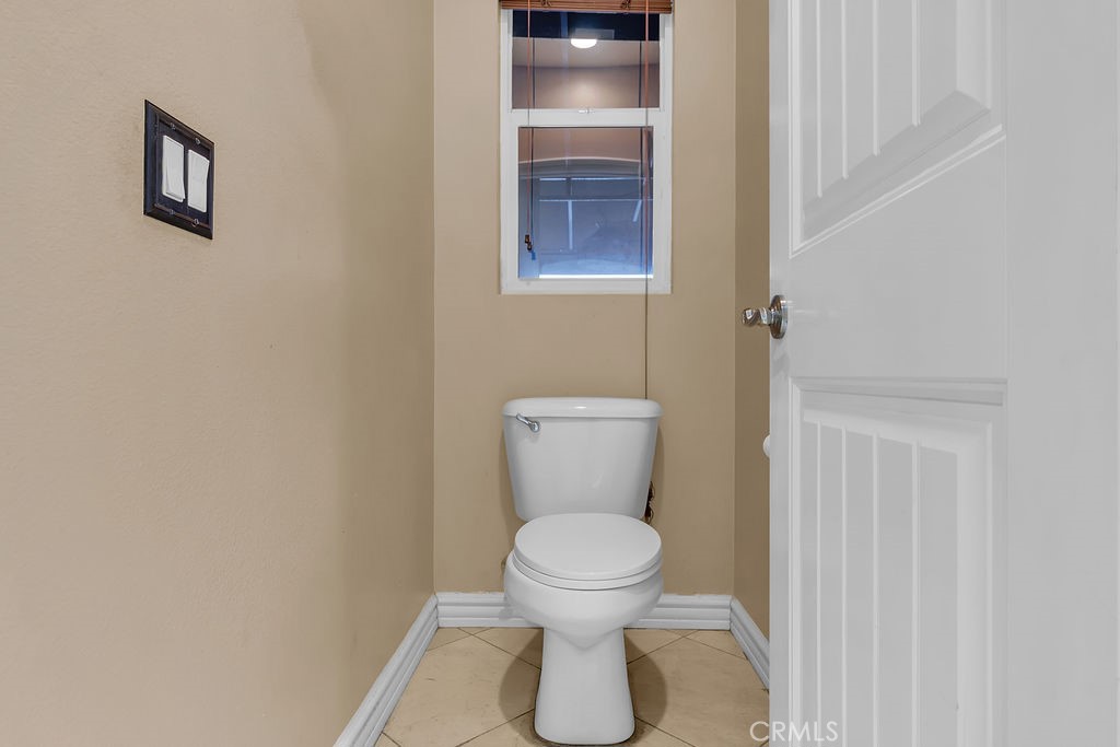 42740 Portraits Lane Temecula, CA 92592 - Photo 32 of 68 a bathroom with a toilet and a sink