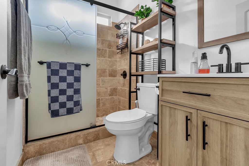 42740 Portraits Lane Temecula, CA 92592 - Photo 39 of 68 a bathroom with a sink toilet and shower