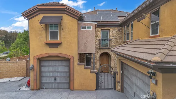 a front view of a house with a garage