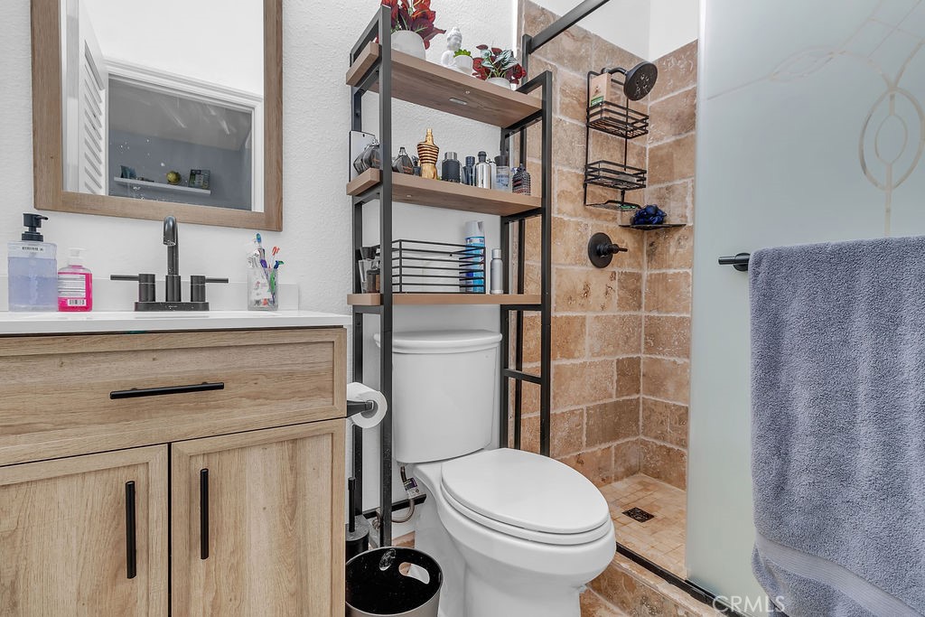 42740 Portraits Lane Temecula, CA 92592 - Photo 45 of 68 a bathroom with a sink toilet and shower