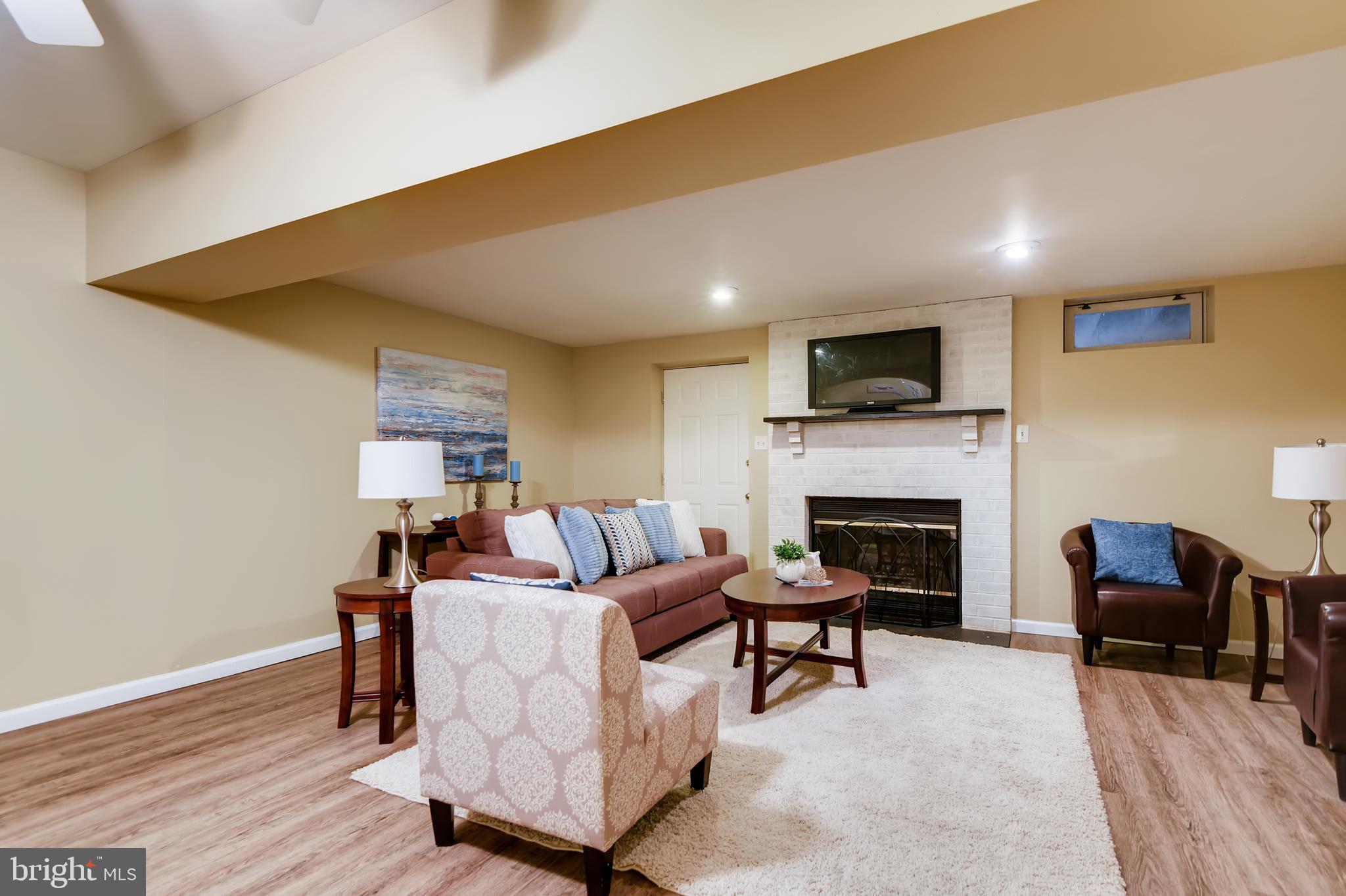 5334 Kelmscot Road Baltimore, MD 21237 - Photo 26 of 33 Finished lower level with fireplace