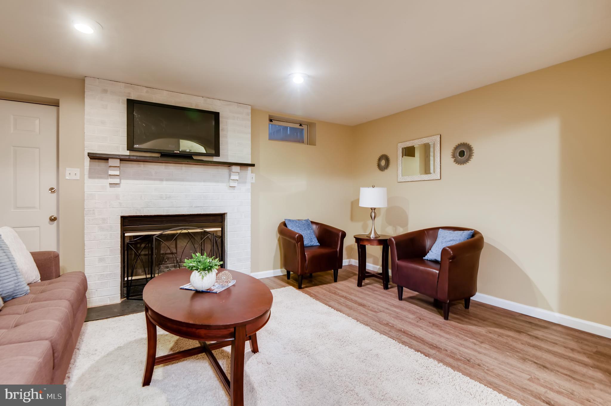 5334 Kelmscot Road Baltimore, MD 21237 - Photo 27 of 33 Finished lower level with fireplace