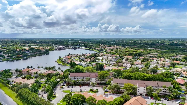 an aerial view of a house with a lake view