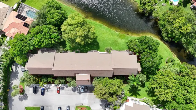 an aerial view of a house with a yard and garden