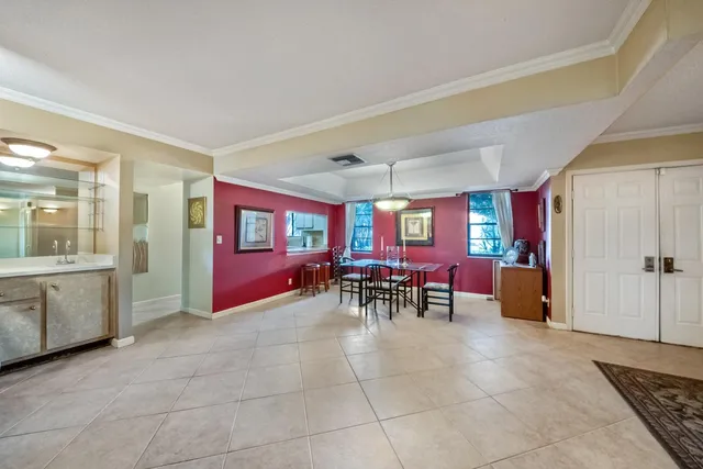 a view of a room with furniture and window