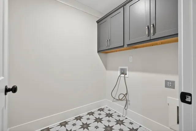 an empty room with a window and a ceiling fan