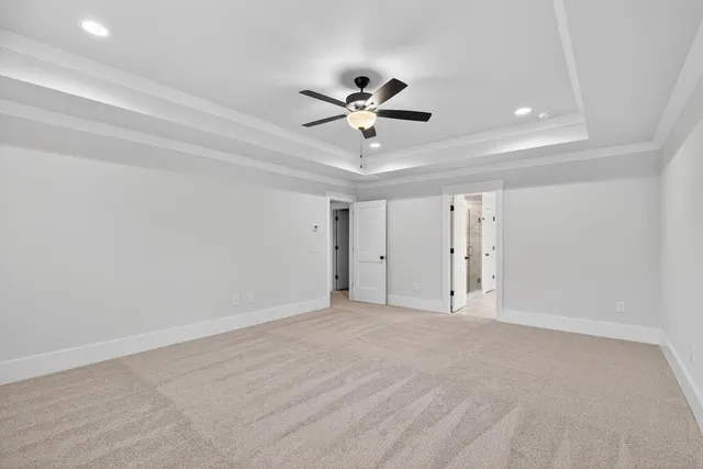 a white bath tub sitting next to a white sink