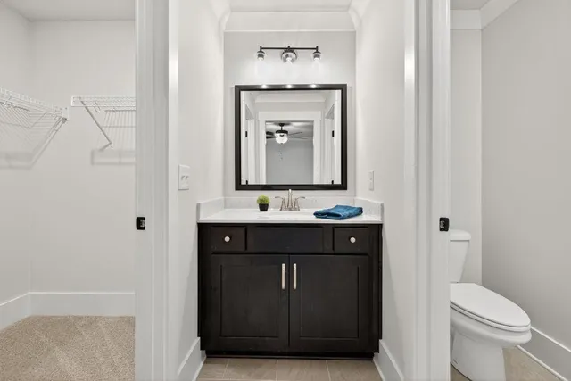 a en suite bathroom with a sink a mirror and a shower