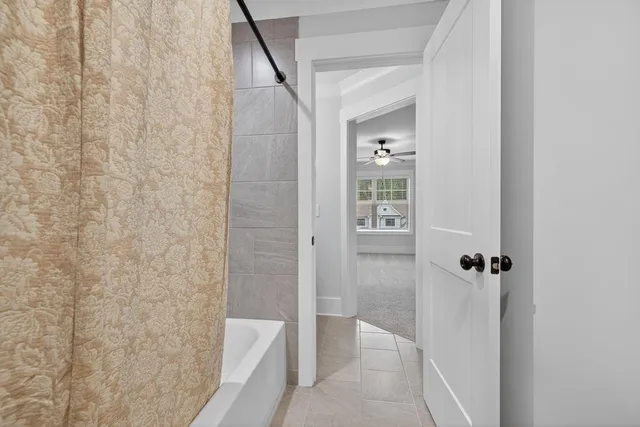a view of a livingroom with a ceiling fan