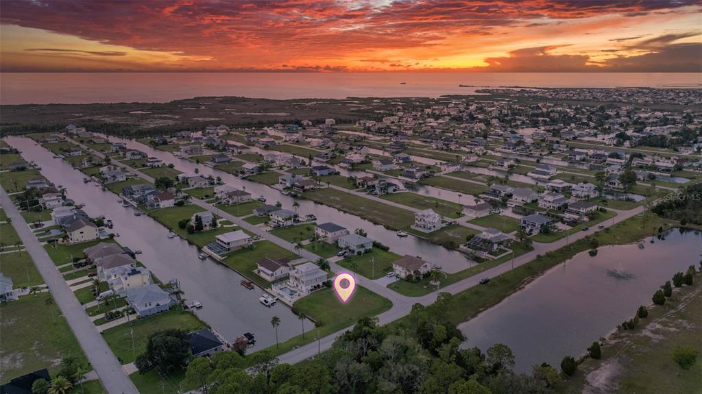 4066 Croaker Drive Hernando Beach, FL 34607 - Photo 2 of 13 an aerial view of residential houses with city view