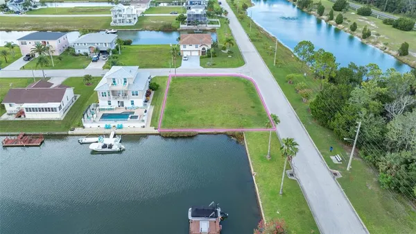 an aerial view of a house with a yard