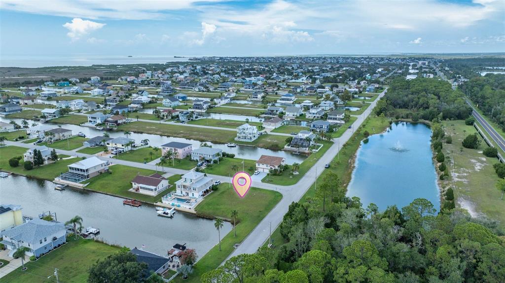 4066 Croaker Drive Hernando Beach, FL 34607 - Photo 6 of 13 an aerial view of a house with a yard