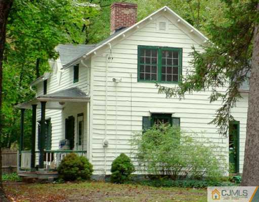 1004 Ridge Road Monmouth Junction, NJ 08852 - Photo 1 of 2 a front view of a house with garden