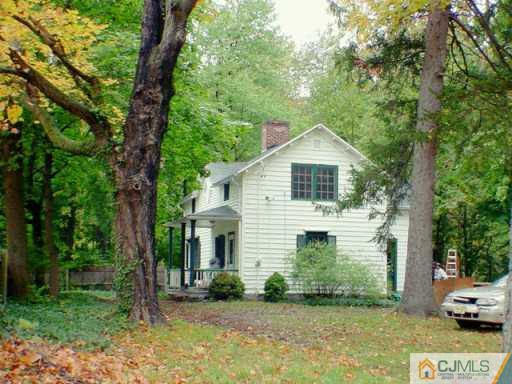 1004 Ridge Road Monmouth Junction, NJ 08852 - Photo 2 of 2 a front view of a house with a garden