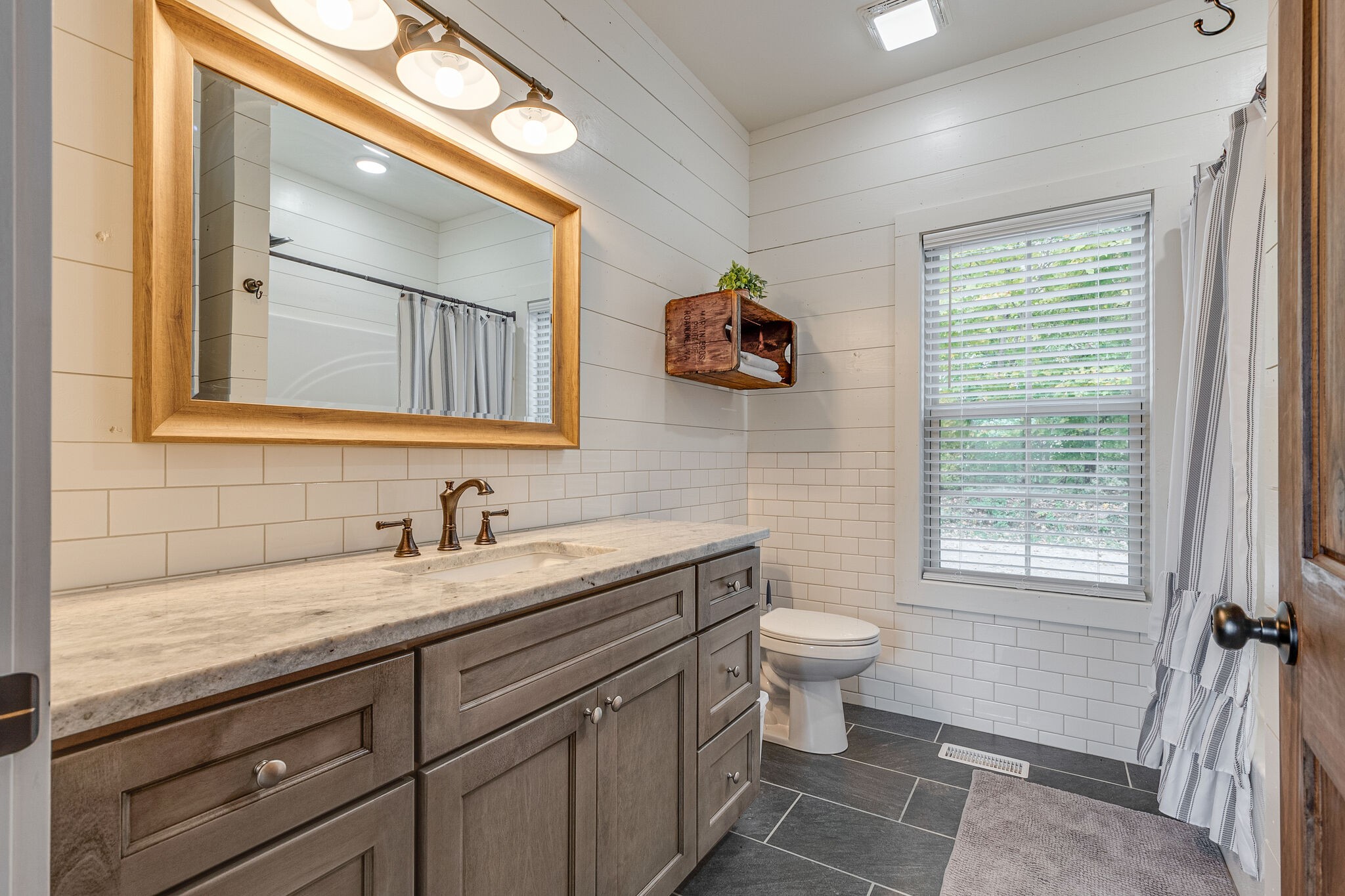 245 Nautilus Point Silver Point, TN 38582 - Photo 21 of 41 a bathroom with a toilet sink and mirror