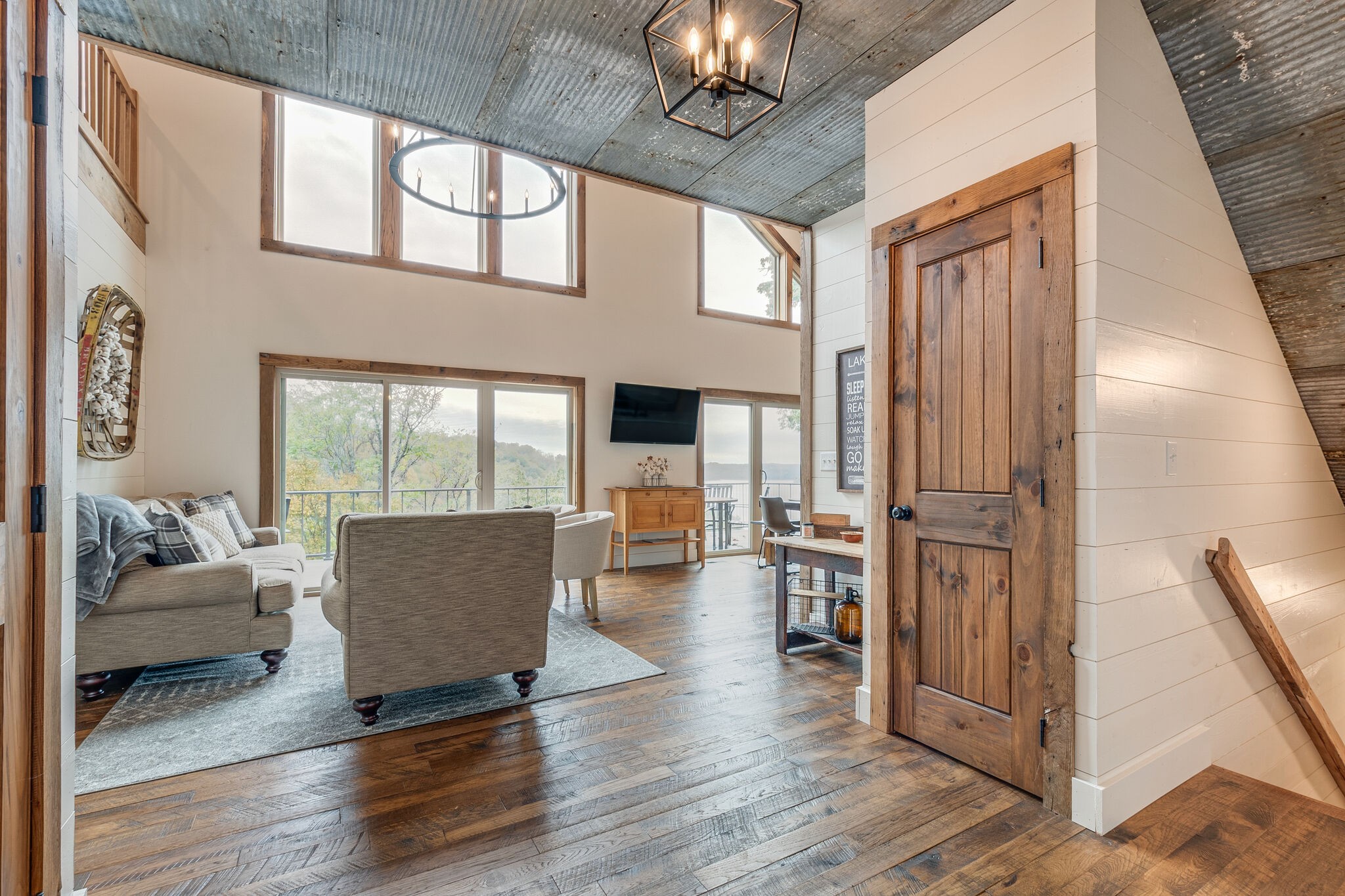 245 Nautilus Point Silver Point, TN 38582 - Photo 5 of 41 a living room with furniture floor to ceiling window and wooden floor