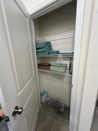 a bedroom with a bed and lamp