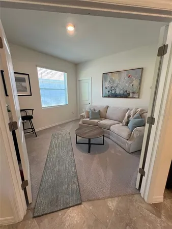 a living room with furniture and a couch