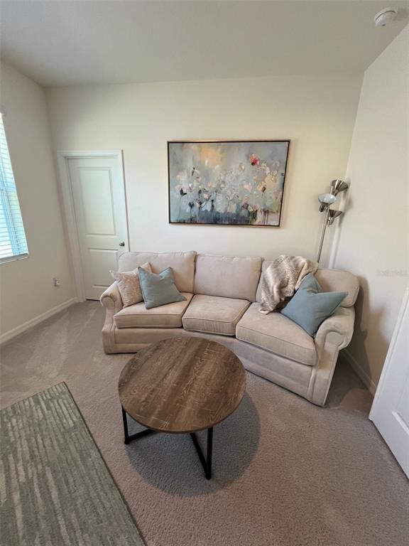 5375 Northwest 48th Lane Ocala, FL 34482 - Photo 22 of 36 a living room with furniture and a couch