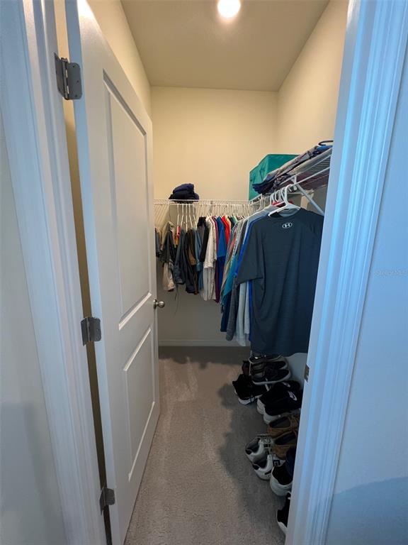 5375 Northwest 48th Lane Ocala, FL 34482 - Photo 24 of 36 a view of walk in closet with clothes and shoes