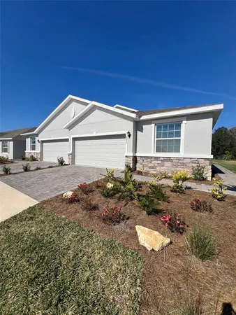 a backyard of a house with yard and outdoor seating