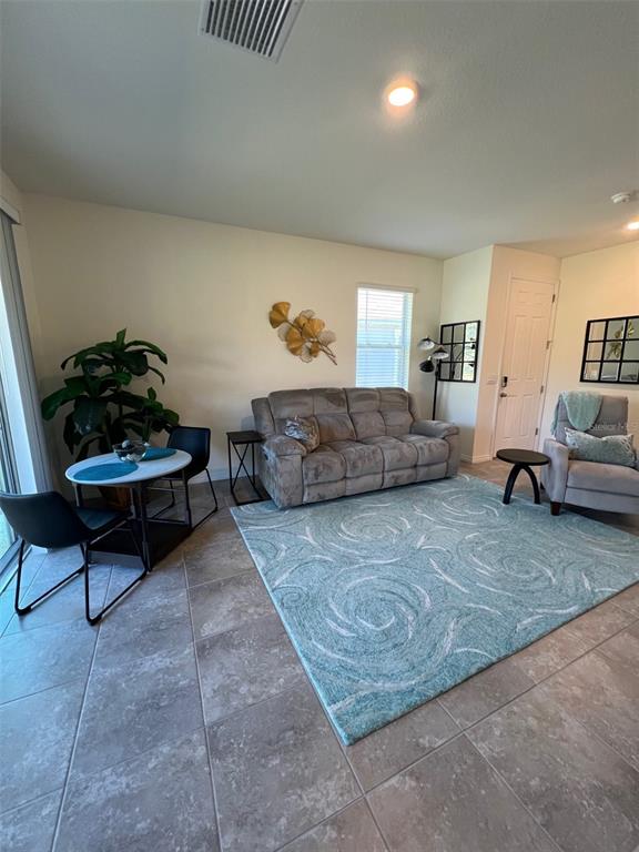 5375 Northwest 48th Lane Ocala, FL 34482 - Photo 6 of 36 a living room with furniture and a couch