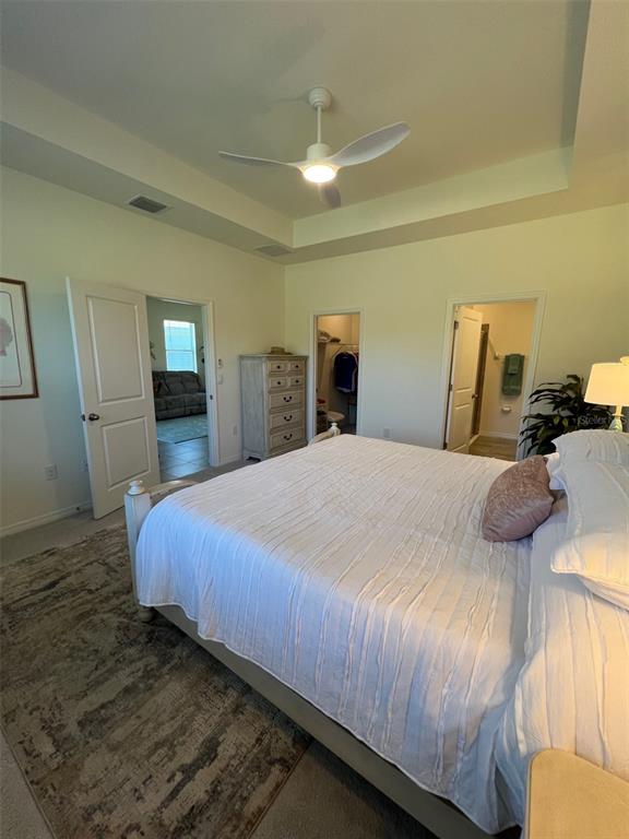 5375 Northwest 48th Lane Ocala, FL 34482 - Photo 9 of 36 a bedroom with a bed and mirror