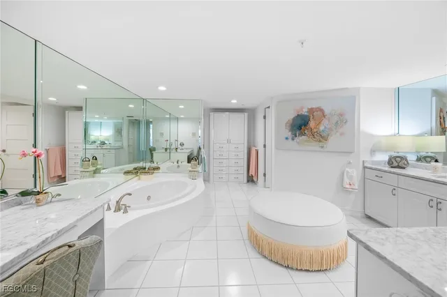 a bathroom with a granite countertop sink a toilet and bathtub