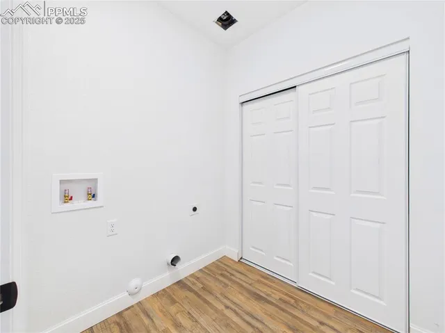 a view of room with hardwood floor