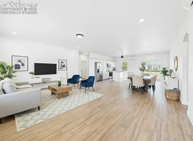 a living room with furniture and a flat screen tv