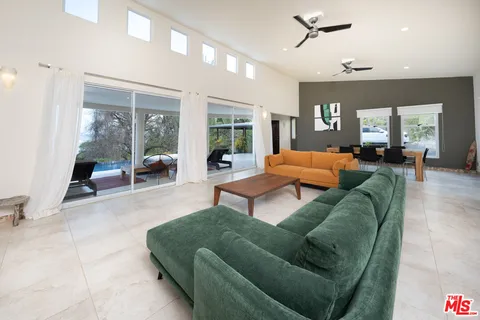 a room with furniture and a large window