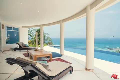 a view of a terrace with furniture