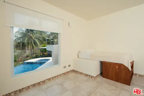 a view of a bathroom with a bathtub and a shower