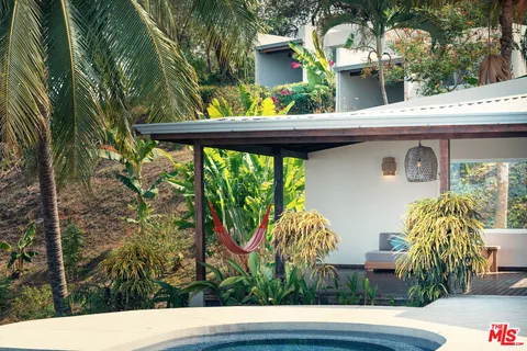 a dining room with a table and chairs