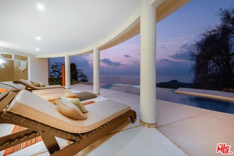 a view of a living room and kitchen
