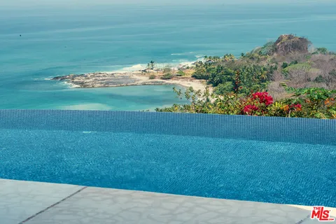 a view of a garden and an ocean