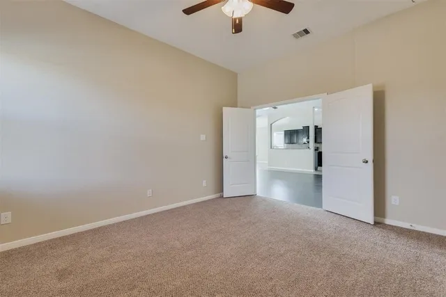 a view of a kitchen with a sink and a refrigerator