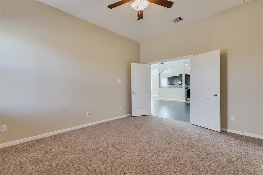 1903 Cadbury Castle Lane Fresno, TX 77545 - Photo 13 of 14 a view of a kitchen with a sink and a refrigerator